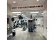 Fitness center with modern equipment, flat-screen TVs, and motivational decor at 6713 Stone River Rd # 206, Bradenton, FL 34203