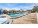 Community pool featuring lounge chairs and meticulous brick work at 6713 Stone River Rd # 206, Bradenton, FL 34203