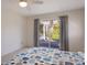 Main bedroom with ceiling fan and view of the backyard at 7204 18Th W Ave, Bradenton, FL 34209