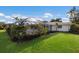 The exterior of the home features a well-manicured yard at 7204 18Th W Ave, Bradenton, FL 34209