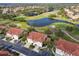 Aerial view of a well-maintained property situated near a golf course, enhancing its appeal and recreational opportunities at 7232 Cedar Hollow Cir # 7232, Bradenton, FL 34203