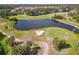 Beautiful aerial view of a lush community golf course with tranquil lake features and impeccably maintained greens at 7232 Cedar Hollow Cir # 7232, Bradenton, FL 34203