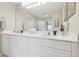 Bathroom featuring double sink vanity, tile floors, with a large well-lit mirror at 7232 Cedar Hollow Cir # 7232, Bradenton, FL 34203