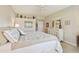 This bedroom features neutral colors, carpet, overhead storage, and a bright, sunny window at 7232 Cedar Hollow Cir # 7232, Bradenton, FL 34203