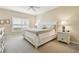 Bright bedroom features a ceiling fan, neutral color palette, plantation shutters, and carpet flooring at 7232 Cedar Hollow Cir # 7232, Bradenton, FL 34203