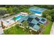 Aerial view showcasing the community pool, clubhouse, hot tub and tennis courts at 7232 Cedar Hollow Cir # 7232, Bradenton, FL 34203