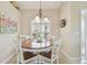 Bright and sunny dining area with a round table, chair set, and large window at 7232 Cedar Hollow Cir # 7232, Bradenton, FL 34203