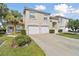 Two-story townhouse with dual garage, red tile roof, and well-maintained landscaping at 7232 Cedar Hollow Cir # 7232, Bradenton, FL 34203