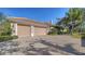 Well-maintained home exterior featuring a three-car garage and a driveway with brick pavers at 7303 Westminster Ct, University Park, FL 34201