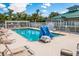 Beautiful community pool with plenty of lounge chairs for relaxing by the water at 7608 Teal Trce, Bradenton, FL 34203