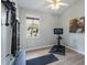 Bright exercise room with a peloton bike, weights, and luxury vinyl flooring at 7608 Teal Trce, Bradenton, FL 34203