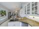 Open kitchen with granite counters and white cabinets looking into the living and dining areas at 7608 Teal Trce, Bradenton, FL 34203