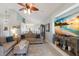 Open concept living room with a view of the kitchen and dining area, featuring modern decor at 7608 Teal Trce, Bradenton, FL 34203