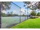 Well-maintained community tennis court with lighting and fencing at 7608 Teal Trce, Bradenton, FL 34203