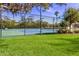 Well-maintained community tennis court with mature landscaping at 7608 Teal Trce, Bradenton, FL 34203