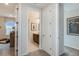 Hallway with multiple doorways leading to various rooms, showcasing the home's layout at 8516 Golden Dawn Ct, Sarasota, FL 34241