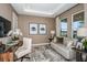 Living room features neutral walls, a decorative rug, and contemporary furnishings at 8516 Golden Dawn Ct, Sarasota, FL 34241