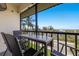 Screened balcony featuring views of the beach, Intracoastal and updated outdoor furniture at 901 Beach Rd # 402, Sarasota, FL 34242