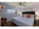 Comfortable bedroom with beach views, large window, and ceiling fan at 901 Beach Rd # 402, Sarasota, FL 34242