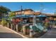 A vibrant exterior with blue umbrellas and decorative barrels at 901 Beach Rd # 402, Sarasota, FL 34242