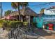 The Cottage restaurant, a tiki hut with lush foliage at 901 Beach Rd # 402, Sarasota, FL 34242