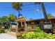 Charming waterfront restaurant with tropical landscaping and inviting entrance at 901 Beach Rd # 402, Sarasota, FL 34242