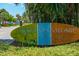 Siesta Key Village welcome sign in a sunny tropical setting at 901 Beach Rd # 402, Sarasota, FL 34242