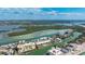 Breathtaking aerial view showcasing waterfront condos surrounded by canals, mangroves, and expansive coastal scenery at 9200 Midnight Pass Rd # 20, Sarasota, FL 34242