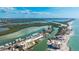 Drone shot of the condo in a coastal community with a pool and boat dock in the intercoastal at 9200 Midnight Pass Rd # 20, Sarasota, FL 34242