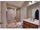 Bathroom featuring a glass enclosed shower, single sink vanity, and standard toilet at 10811 High Noon Trl, Parrish, FL 34219