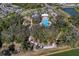 Overhead shot of walking paths, playground, splash pad, and pool in community at 10811 High Noon Trl, Parrish, FL 34219