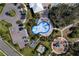 Aerial view of community splash pad, playground and outdoor amenity area at 10811 High Noon Trl, Parrish, FL 34219