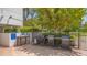 Outdoor grilling area with multiple barbecue grills and preparation space at 1105 Gulf Of Mexico Dr # 603, Longboat Key, FL 34228