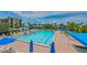 Enjoy the expansive pool surrounded by lush tropical landscaping, chairs and umbrellas at 1105 Gulf Of Mexico Dr # 603, Longboat Key, FL 34228