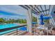 Relax poolside with sun loungers and shaded seating area at 1105 Gulf Of Mexico Dr # 603, Longboat Key, FL 34228