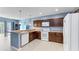 Functional kitchen featuring wood cabinets and white appliances at 1122 42Nd E Ter, Bradenton, FL 34208