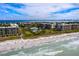 Aerial view of condo buildings near the water, offering resort-style community and stunning scenery at 1145 Gulf Of Mexico Dr # 305, Longboat Key, FL 34228