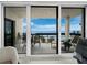 Interior view of a balcony with stunning ocean views and outdoor seating at 1145 Gulf Of Mexico Dr # 305, Longboat Key, FL 34228