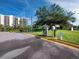 Exterior shot of a car wash and parking area with lush landscaping, providing a convenient and well-maintained space at 1145 Gulf Of Mexico Dr # 305, Longboat Key, FL 34228