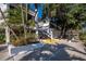 Exterior of a building featuring a stairway, landscaping and a sidewalk at 1145 Gulf Of Mexico Dr # 305, Longboat Key, FL 34228