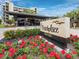 Eye-level outdoor view of the Beachplace sign surrounded by flowers and manicured landscaping at 1145 Gulf Of Mexico Dr # 305, Longboat Key, FL 34228