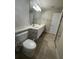 Bathroom featuring double sinks, tile floors, and modern lighting at 11629 Garessio Ln, Sarasota, FL 34238