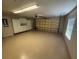 Large two car garage featuring painted floor and an abundance of storage at 11629 Garessio Ln, Sarasota, FL 34238