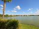 Picturesque lake view with lush greenery and a tranquil setting at 11629 Garessio Ln, Sarasota, FL 34238