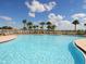 Large community pool with plenty of lounge chairs at 11629 Garessio Ln, Sarasota, FL 34238