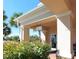 Exterior shot of the community Post Office in a building with columns, plants, and a post office sign at 11629 Garessio Ln, Sarasota, FL 34238