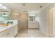 Bright bathroom featuring dual vanity, a glass shower, and tiled flooring at 12510 Ghiberti Cir # 102, Venice, FL 34293