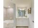 Bathroom featuring tub, vanity, and modern fixtures at 12510 Ghiberti Cir # 102, Venice, FL 34293