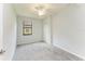 Bedroom with carpet, ceiling fan, closet, and a window at 12510 Ghiberti Cir # 102, Venice, FL 34293