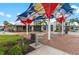 Red, white, and blue shade sails highlight a comfortable community gathering spot at 12510 Ghiberti Cir # 102, Venice, FL 34293